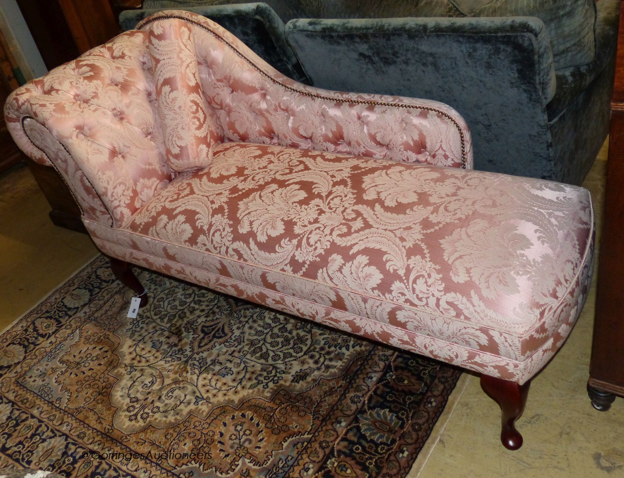 A Victorian style chaise longue upholstered in patterned pink damask, length 160cm, depth 58cm, height 80cm